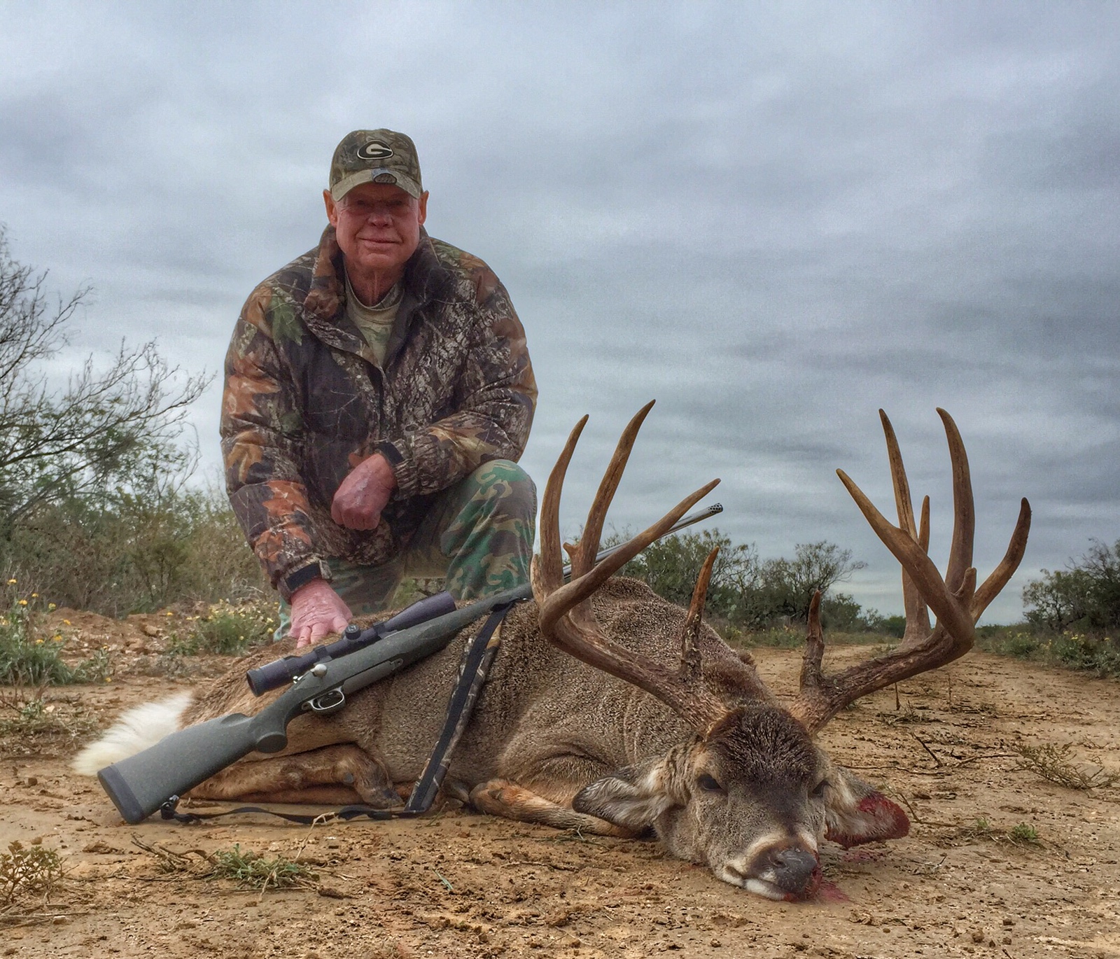 Hunter with trophy whitetail buck